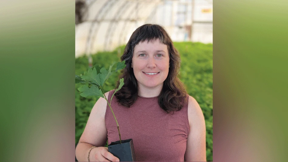 Claire Zuidervliet: She is standing inside a greenhouse filled with native plants growing at Octoraro Native Plant Nursery.